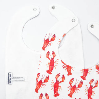 White bib with red lobster pattern on a white background