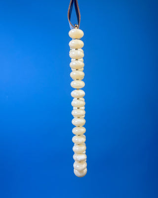 Chunky marbled resin bead statement necklace with oversized cream beads, gold-tone spacer accents, adjustable clasp closure, and lightweight design, available in multiple colors.