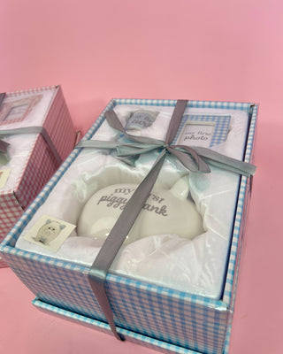 Gift box with a decorative bow on a pink background
