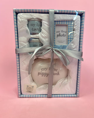 Woman wearing a decorative shirt with colorful designs on a pink background