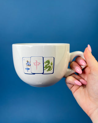 Shop the Gumbo Mug featuring durable ceramic construction, oversized design, comfortable handle, and unique artwork. Available in multiple styles.