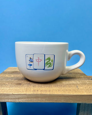 Shop the Gumbo Mug featuring durable ceramic construction, oversized design, comfortable handle, and unique artwork. Available in multiple styles.