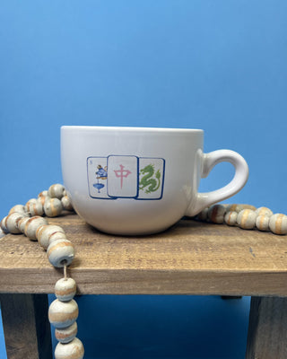 Shop the Gumbo Mug featuring durable ceramic construction, oversized design, comfortable handle, and unique artwork. Available in multiple styles.