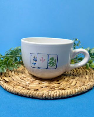 Shop the Gumbo Mug featuring durable ceramic construction, oversized design, comfortable handle, and unique artwork. Available in multiple styles.