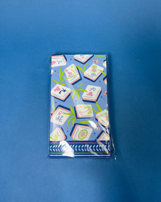 Package of Mahjong Guest Napkins featuring colorful Mahjong tile illustrations with bamboo leaves on a soft blue background. Premium 3-ply paper guest towels for entertaining and game nights.