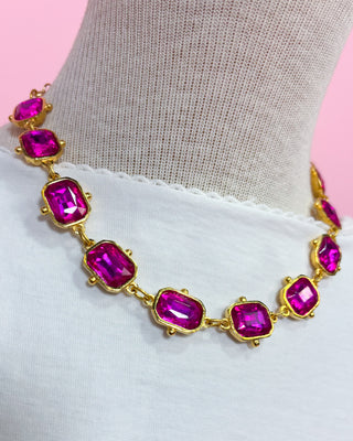 Necklace with pink gemstones on a white background