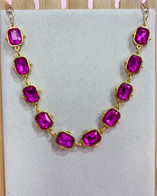 Necklace with pink gemstones on a light gray background
