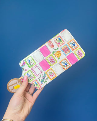 Mahjong charcuterie board with coordinating spreader featuring colorful Mahjong tile artwork and cork backing for serving cheese, appetizers, and snacks during game nights and entertaining.