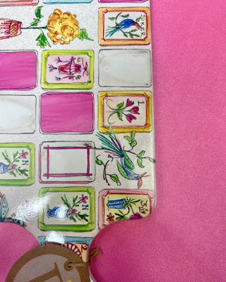 Mahjong charcuterie board with coordinating spreader featuring colorful Mahjong tile artwork and cork backing for serving cheese, appetizers, and snacks during game nights and entertaining.