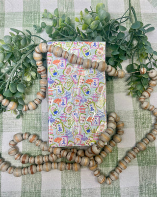 Colorful Mahjong Guest Napkins featuring watercolor Mahjong tiles, pagodas, fans, and floral artwork for game night entertaining and party décor.