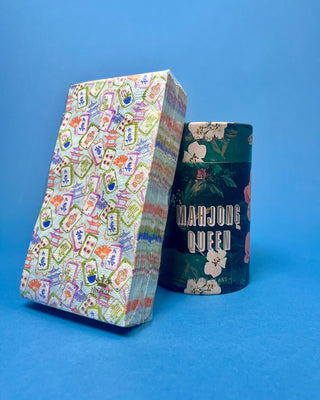 Colorful Mahjong Guest Napkins featuring watercolor Mahjong tiles, pagodas, fans, and floral artwork for game night entertaining and party décor.