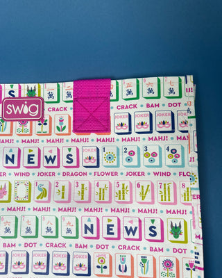 Mahjong Reusable Bag with colorful Mahjong tile print and bright pink handles, foldable reusable shopping tote for errands, gifts, and game nights.
