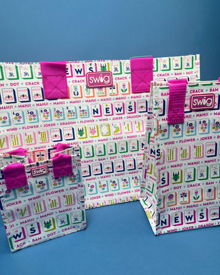 Mahjong Reusable Bag with colorful Mahjong tile print and bright pink handles, foldable reusable shopping tote for errands, gifts, and game nights.