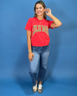 a red graphic t-shirt with leopard print lettering that reads 'LULU MAC"