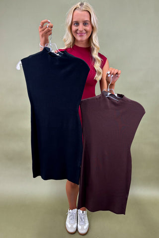 Woman wearing a sleeveless burgundy bodycon mini dress styled with white sneakers, boutique fashion photography on olive backdro