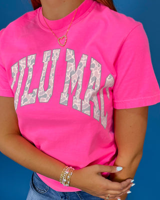 a bright pink short-sleeve t-shirt with 'LULU MAC' printed in white camo arched letters across the chest