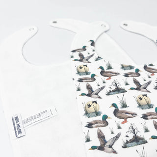 Decorative hanging tags with duck illustrations on a white background