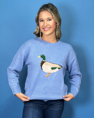 Light blue crew neck sweater featuring a mallard duck design, long sleeves, ribbed cuffs, and a ribbed hem.