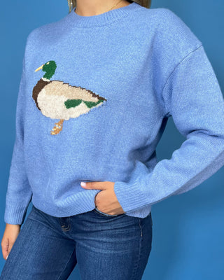 Light blue crew neck sweater featuring a mallard duck design, long sleeves, ribbed cuffs, and a ribbed hem.