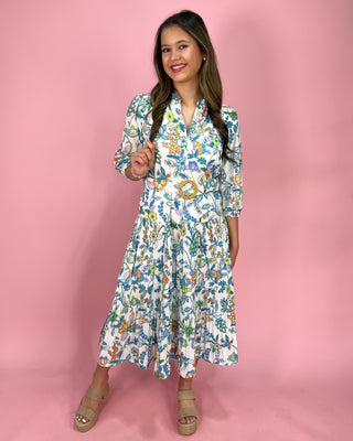 Woman wearing a floral dress against a pink background