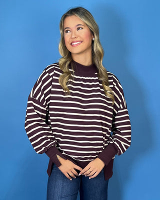 Burgundy and ivory striped oversized pullover top with long sleeves, ribbed trim, and relaxed fit.