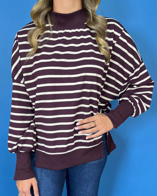 Burgundy and ivory striped oversized pullover top with long sleeves, ribbed trim, and relaxed fit.