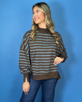 Chocolate brown and dusty blue striped pullover top with mock neckline, long sleeves, ribbed trim, and relaxed fit.