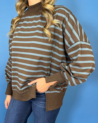 Chocolate brown and dusty blue striped pullover top with mock neckline, long sleeves, ribbed trim, and relaxed fit.