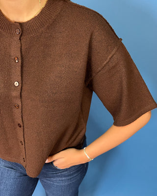 Chocolate brown button-front short sleeve knit cardigan top with a crew neckline, relaxed fit, and cropped length.