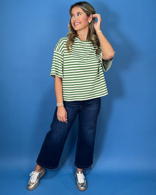 Green and ivory striped oversized top with short sleeves, round neckline, relaxed fit, and casual everyday style.