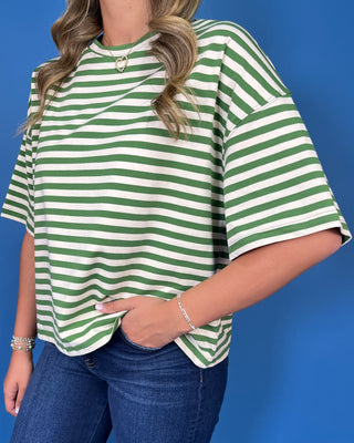 Green and ivory striped oversized top with short sleeves, round neckline, relaxed fit, and casual everyday style.