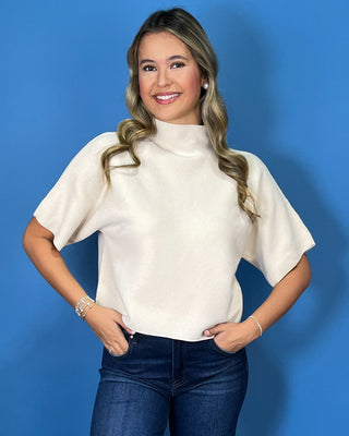 Ivory ribbed mock neck sweater top with short dolman sleeves, relaxed fit, and a clean, versatile silhouette.