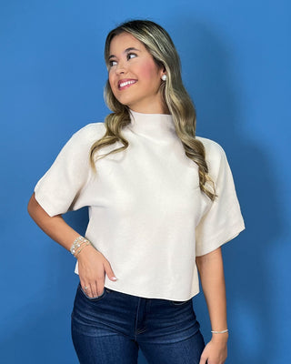 Ivory ribbed mock neck sweater top with short dolman sleeves, relaxed fit, and a clean, versatile silhouette.