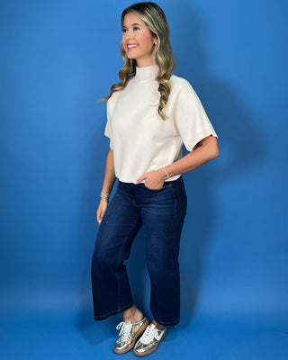 Ivory ribbed mock neck sweater top with short dolman sleeves, relaxed fit, and a clean, versatile silhouette.
