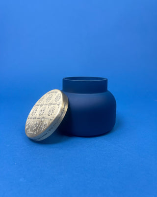 Capri Blue Volcano Artisan Terrazza Candle displayed on solid blue background. 