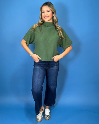 Olive green ribbed mock neck sweater top with short dolman sleeves, relaxed fit, and a soft, versatile everyday look.