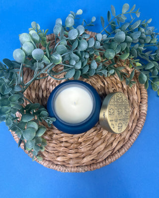 Capri Blue Volcano Artisan Terrazza Candle displayed on solid blue background. 