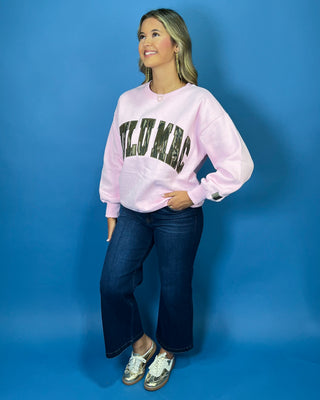 Pink long sleeve crewneck sweatshirt featuring oversized “LULU MAC” lettering with a camouflage print