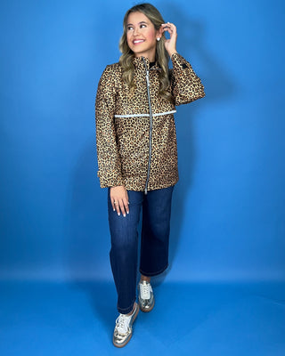 Lulu Mac leopard print zip-up jacket with a high collar, reflective waist detail, long sleeves, and side pockets.