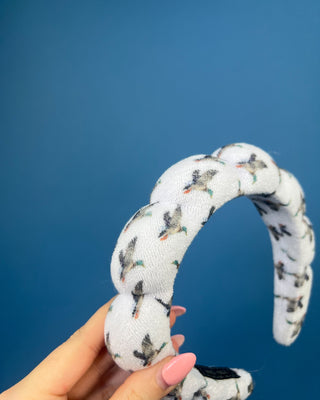 Duck print padded braided headband with soft white fabric and flying duck pattern.