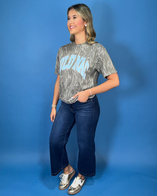Lulu Mac gray camo graphic tee with bold light blue collegiate lettering and a relaxed short sleeve fit.