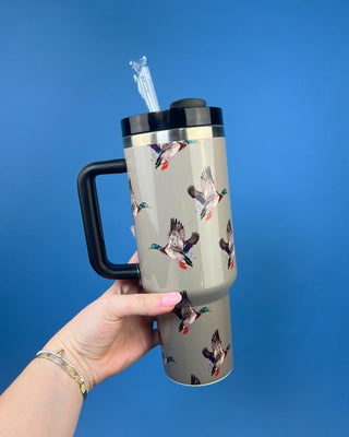 Green insulated stainless steel tumbler with handle, reusable straw, secure lid, and flying mallard duck print.
