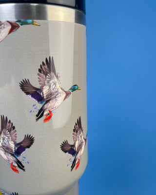 Green insulated stainless steel tumbler with handle, reusable straw, secure lid, and flying mallard duck print.