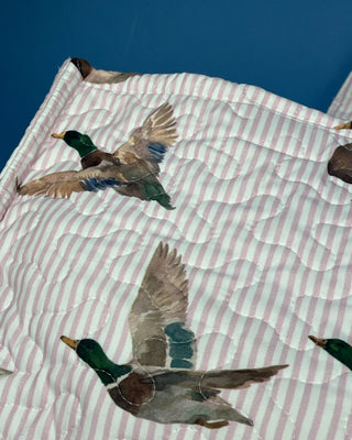 Quilted Ida Mae Home tote bag with watercolor mallard duck print, striped fabric, spacious interior, and padded shoulder straps.