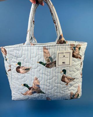 Ida Mae Home quilted handbag with pink and blue striped fabric, mallard duck print, padded shoulder straps, and spacious open interior.