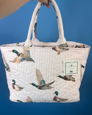 Ida Mae Home quilted handbag with pink and blue striped fabric, mallard duck print, padded shoulder straps, and spacious open interior.