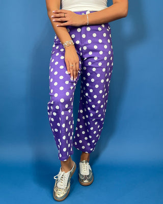 Purple high-rise polka dot pants with bold white dots, a flattering straight-leg silhouette, and cropped ankle length.