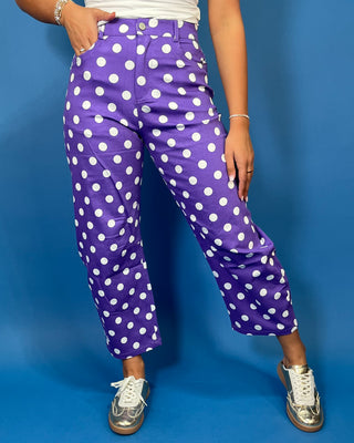 Purple high-rise polka dot pants with bold white dots, a flattering straight-leg silhouette, and cropped ankle length.