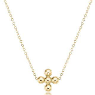 Gold necklace with a unique pendant design on a white background