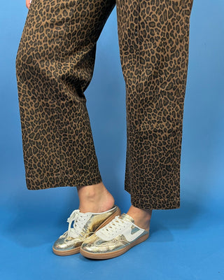 Brown leopard print high-rise pants with a flattering wide-leg silhouette, cropped length, and convenient side pockets.